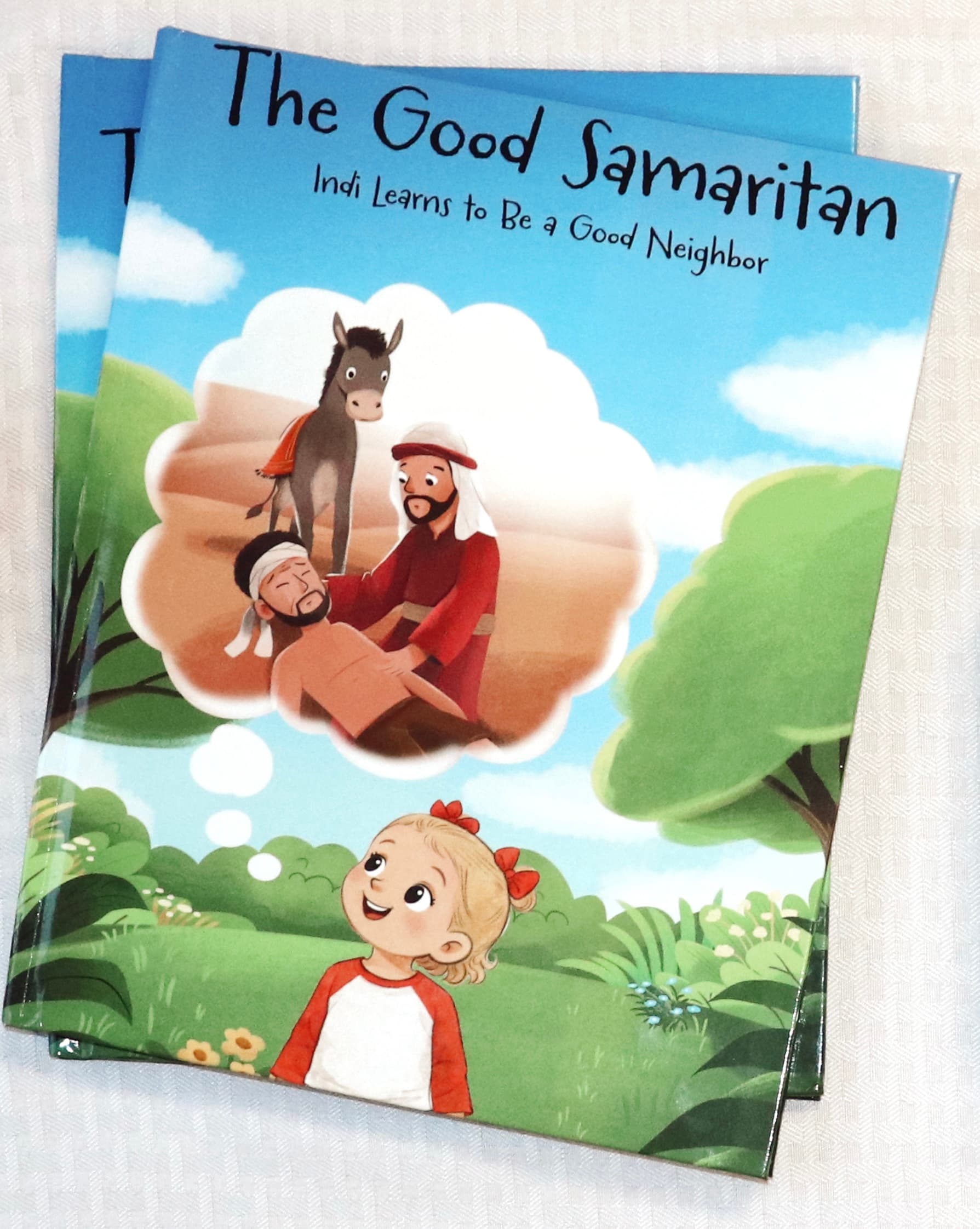 A family reading a PaperPetal book together on a bench